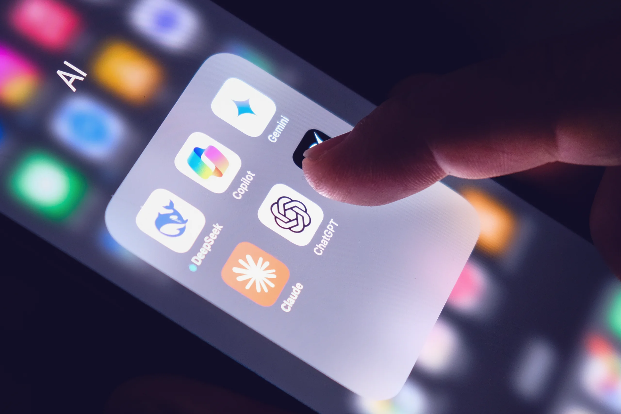 Person selecting an AI assistant app on a phone to book business travel